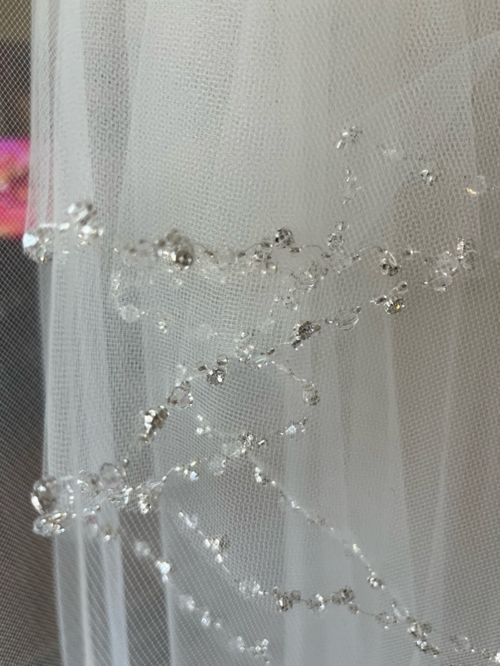 David’s Bridal  Wedding veil. NWT. Finger tip length with Crystal Beaded Edging